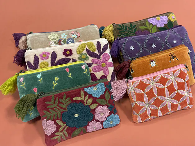 Hand-embroidered velvet pouches